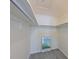 Walk-in closet with ample storage space and neutral carpeting at 9514 Colonial Dr, Bradenton, FL 34210