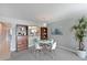 Cozy dining area adjacent to the kitchen with modern light fixture at 9514 Colonial Dr, Bradenton, FL 34210