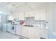 Efficiently designed kitchen with laundry appliances and modern fixtures at 9514 Colonial Dr, Bradenton, FL 34210