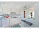 Well-lit kitchen with a breakfast bar opening to the adjacent dining area at 9514 Colonial Dr, Bradenton, FL 34210