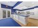 Community kitchen with white cabinetry and large island, perfect for gatherings at 9514 Colonial Dr, Bradenton, FL 34210