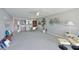 Spacious living room with dining area, modern decor, and plenty of natural light at 9514 Colonial Dr, Bradenton, FL 34210