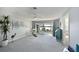 Comfortable living room with sliding glass doors to patio, showcasing serene lake views at 9514 Colonial Dr, Bradenton, FL 34210
