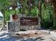 Entrance sign for De Soto National Memorial, set in a stone structure, inviting visitors to explore the park at 9514 Colonial Dr, Bradenton, FL 34210