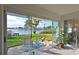 Tranquil patio with scenic water views, comfortable seating, and lush landscaping for peaceful outdoor enjoyment at 9514 Colonial Dr, Bradenton, FL 34210