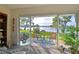 Relaxing patio view of the lake, enhanced by outdoor seating and lush landscaping at 9514 Colonial Dr, Bradenton, FL 34210
