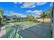 Organized shuffleboard courts with benches and a covered seating area, perfect for recreation at 9514 Colonial Dr, Bradenton, FL 34210