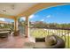 Relaxing balcony with seating overlooking the lush landscape and nearby buildings at 9623 Sea Turtle Ter # 201, Bradenton, FL 34212