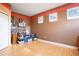 Bedroom featuring a wood floor and neutral walls with painted accent trim at 9623 Sea Turtle Ter # 201, Bradenton, FL 34212