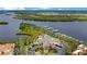 An aerial view of the club house, marina, and surrounding waterways and neighborhood at 9623 Sea Turtle Ter # 201, Bradenton, FL 34212