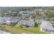 Aerial view of a single-Gathering home with a large backyard and surrounding neighborhood at 1521 Graber Ave, Sarasota, FL 34239