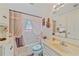 Clean bathroom with white vanity and shower/tub combo at 1521 Graber Ave, Sarasota, FL 34239