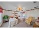 Twin bedroom with two beds and a ceiling fan at 1521 Graber Ave, Sarasota, FL 34239
