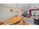 Cozy dining area with wood table and view into living room at 1521 Graber Ave, Sarasota, FL 34239