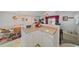 Kitchen features a breakfast bar and white cabinets at 1521 Graber Ave, Sarasota, FL 34239