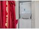 Small laundry room with stackable washer and dryer at 1521 Graber Ave, Sarasota, FL 34239