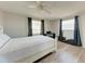 Cozy bedroom with a full-size bed and a view at 1777 Pomelo Dr, Venice, FL 34293
