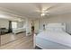 Bedroom with a full bed and mirrored closet doors at 1777 Pomelo Dr, Venice, FL 34293