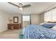 Spacious bedroom with large bed, dresser, and ceiling fan at 1777 Pomelo Dr, Venice, FL 34293
