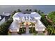 Luxury waterfront home with metal roof, expansive patio, and lush landscaping at 178 N Washington Dr, Sarasota, FL 34236