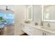 Modern bathroom with double vanity and LED mirrors at 178 N Washington Dr, Sarasota, FL 34236