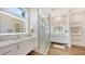 Modern bathroom with frameless shower and double vanity at 178 N Washington Dr, Sarasota, FL 34236