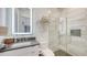 Modern bathroom with a glass shower, floating vanity, and LED mirror at 178 N Washington Dr, Sarasota, FL 34236