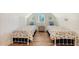 Two twin beds in a well-lit bedroom with nautical decor at 178 N Washington Dr, Sarasota, FL 34236