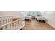Charming bedroom with two twin beds and light wood floors at 178 N Washington Dr, Sarasota, FL 34236