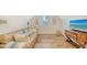 Relaxing bonus room with a comfortable couch and large TV at 178 N Washington Dr, Sarasota, FL 34236