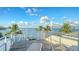 Private deck overlooking the water with lounge chairs at 178 N Washington Dr, Sarasota, FL 34236