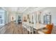 Modern dining area with hardwood floors and fireplace at 178 N Washington Dr, Sarasota, FL 34236