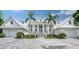 Two-story home with white exterior and gray driveway at 178 N Washington Dr, Sarasota, FL 34236