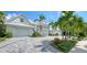 White two-story home with gray paver driveway at 178 N Washington Dr, Sarasota, FL 34236