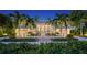 Beautiful home with white exterior, landscaping and driveway at 178 N Washington Dr, Sarasota, FL 34236