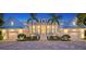 Elegant waterfront home with a white exterior, metal roof, and beautifully landscaped grounds at 178 N Washington Dr, Sarasota, FL 34236