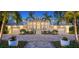 Elegant home with white exterior, landscaping and lighting at 178 N Washington Dr, Sarasota, FL 34236