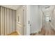 Modern home elevator and hallway with light wood floors at 178 N Washington Dr, Sarasota, FL 34236