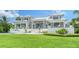 Modern two-story home with metal roof and manicured lawn at 178 N Washington Dr, Sarasota, FL 34236