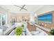 Spacious living room with sectional sofa and large TV at 178 N Washington Dr, Sarasota, FL 34236