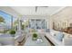 Comfortable living room with sectional sofa and water views at 178 N Washington Dr, Sarasota, FL 34236