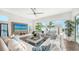 Bright living room with sectional sofa and large windows at 178 N Washington Dr, Sarasota, FL 34236