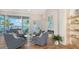 Spacious living room with water views, fireplace, and comfortable seating at 178 N Washington Dr, Sarasota, FL 34236