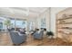 Spacious living room with water views, fireplace, and comfortable seating at 178 N Washington Dr, Sarasota, FL 34236