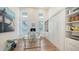 Bright office with glass desk, built-in shelves, and a murphy bed at 178 N Washington Dr, Sarasota, FL 34236