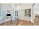 Home office with glass top desk, built-in shelving and murphy bed at 178 N Washington Dr, Sarasota, FL 34236
