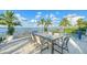 Large patio with dining table and stunning water views at 178 N Washington Dr, Sarasota, FL 34236