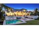Luxury waterfront home with a pool and patio at dusk at 178 N Washington Dr, Sarasota, FL 34236
