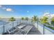 Spacious rooftop deck with water views and lounge chairs at 178 N Washington Dr, Sarasota, FL 34236