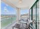 Balcony with seating and panoramic ocean views at 258 Golden Gate Pt # 801, Sarasota, FL 34236